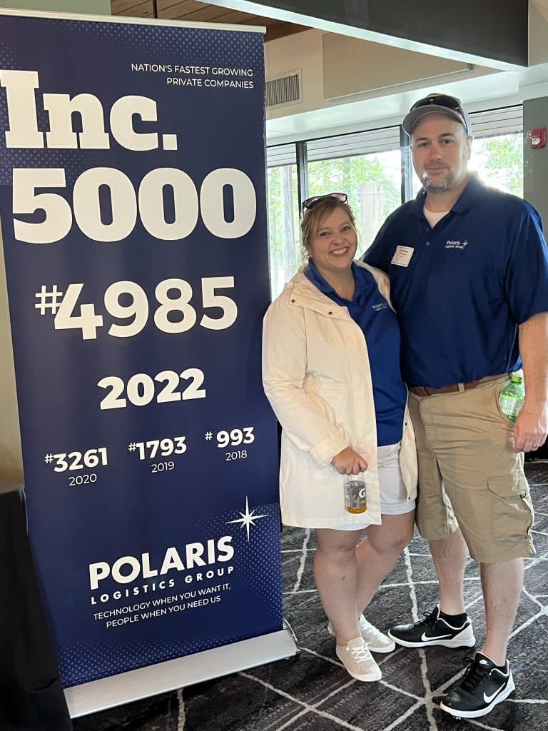 Tammi Nester and Dan Nester at Polaris Logistics Group golf event in fron of Inc 5000 4985 2022 sign